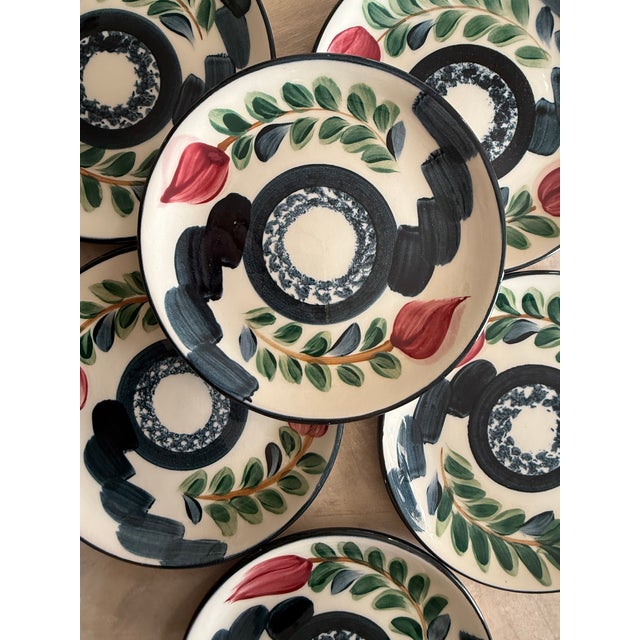 A beautifully cohesive set of six hand-painted studio pottery dessert plates signed P. Silkotch and dated 1993. Created by...