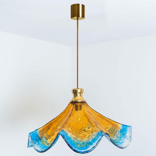 Beautiful floral lamp by mazzega. A downturned flower covered in honey yellow and blue stripes compose this beautiful...