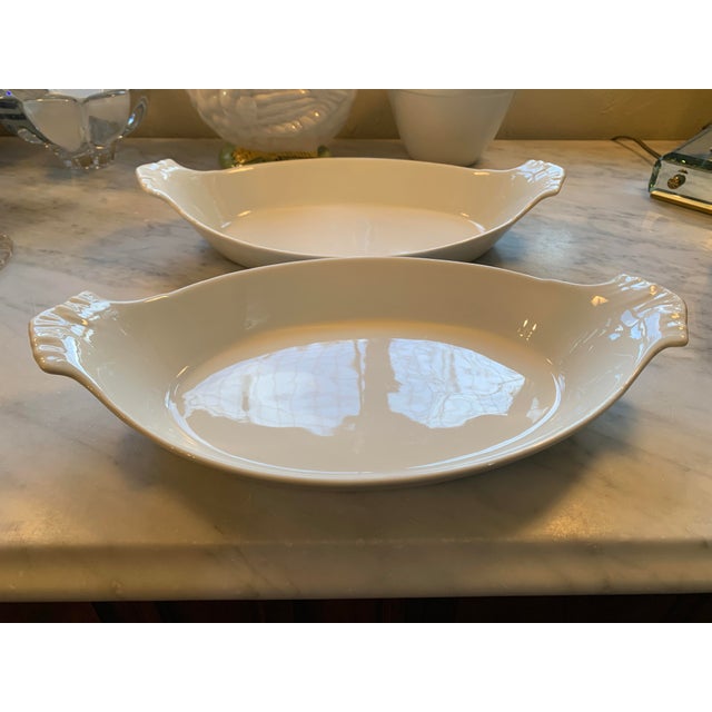 Here we have a pair of white porcelain French au gratin baking dishes. Nice large size at 12.25 inches long and...