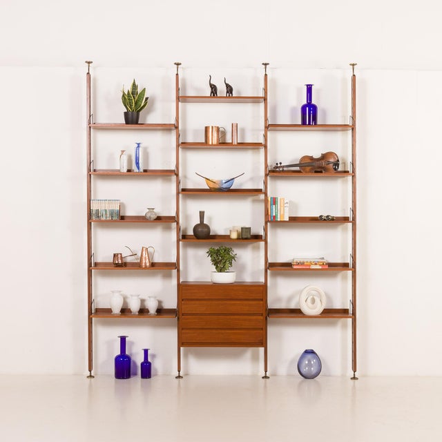 This italian floor-to-ceiling mid-century teak wall unit with a dresser was designed in the 1960s. It can be a perfect...