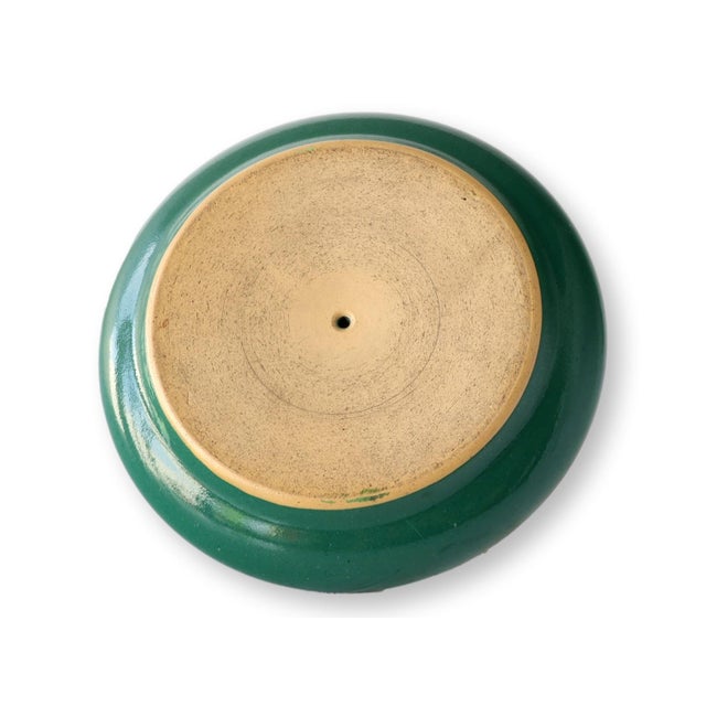A distinctive English stoneware match striker, dating to the early 20th century. Featuring a textured striker surface and...