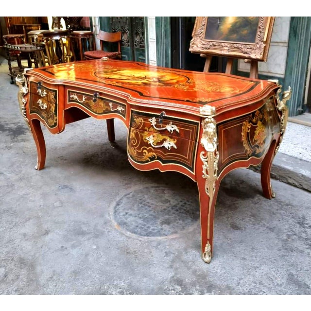 Make a statement with this magnificent French Rococo-style executive desk, crafted in rich wood and decorated with...