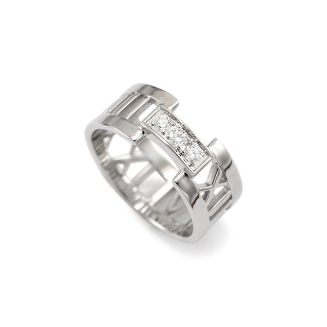 Brand: Tiffany & Co. Gender: Ladies Metal Type: 18K White Gold Ring Size: 6.5 Width: 8.00 mm Weight: 5.59 grams One ladies...