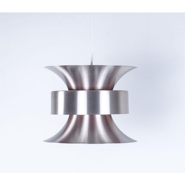 Beautiful diabolo-shaped pendant lamp from the 1960s designed by carl thore for granhaga metallindustri sweden. the lamp...