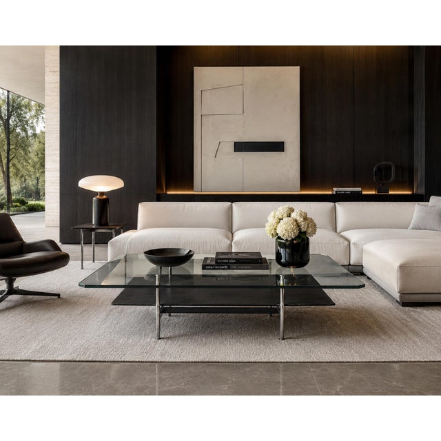 A sophisticated modern coffee table designed by Antonio Citterio for B&B Italia, combining architectural precision with...