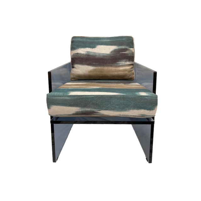 From Caracole, the Reflect Chair is comprised of a custom designed angular tinted acrylic frame with a loose seat and back...