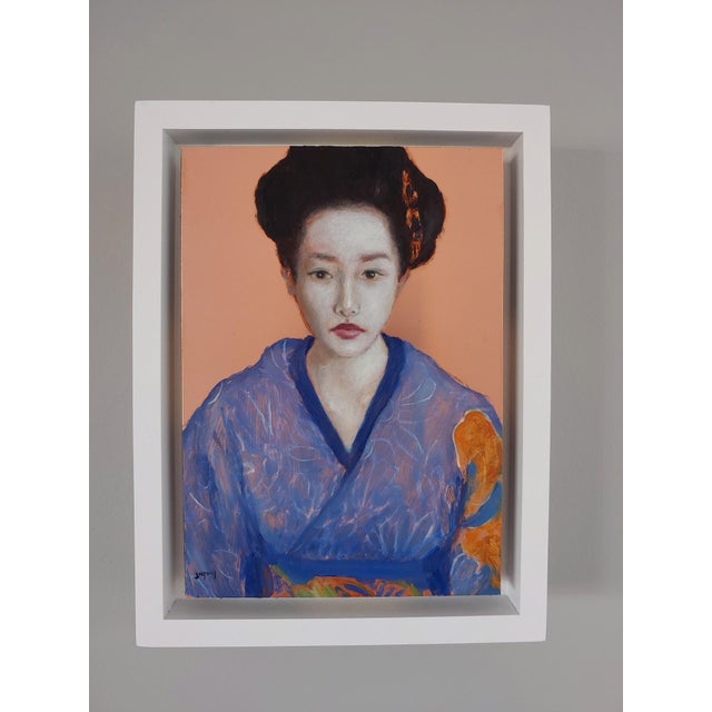 This oil painting on copper panel presents a figure adorned in a vibrant blue kimono, contrasting against a softly glowing...