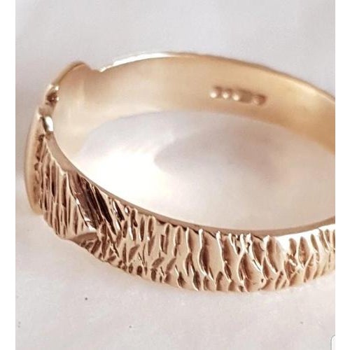 A distinctive vintage british gentleman’s buckle ring by a & a j, crafted in 9-carat yellow gold and fully hallmarked in...