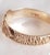 A distinctive vintage british gentleman’s buckle ring by a & a j, crafted in 9-carat yellow gold and fully hallmarked in...