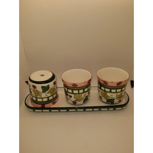 Sweet little trio of planters and matching base, ceramic with grape leaf, pink roses, and blue flowers in the design -...
