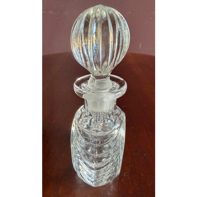 Very nice and unusual pressed glass perfume bottle and original stopper. Fun design.