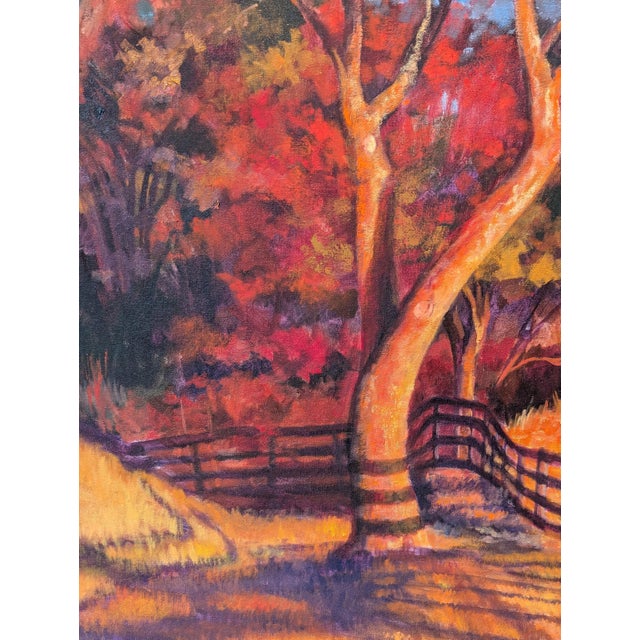 Rich red and orange naturalistic landscape painting by Houston based artist Nancy Paris Pruden. The work features a serene...