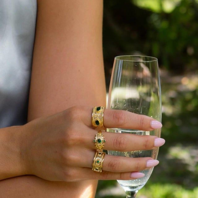Step into the aura of divine royalty with the Goddess Cleopatra Emerald & Gold Adjustable Ring — a radiant statement piece...