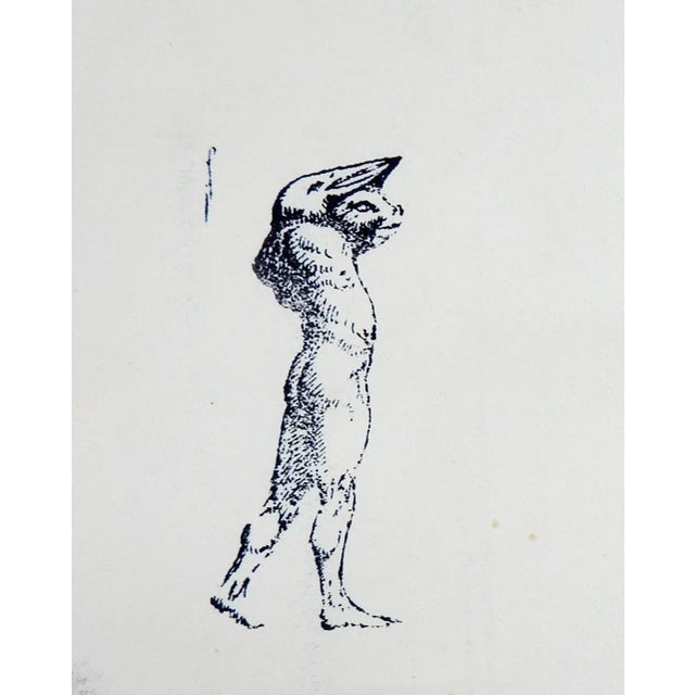 Vintage relief printing block of etched metal mounted on wood block. Male figure with a pig and bird combinination head,...