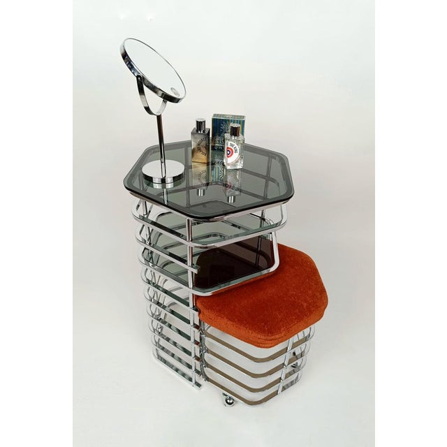 A dressing table with sparkling and mirrored chrome like the rims of vintage cars. Made in Italy between the 60s and 70s,...