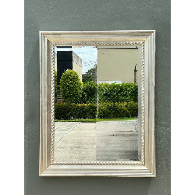 This vintage carved wood wall mirror offers a timeless balance of classic craftsmanship and understated elegance. Framed...