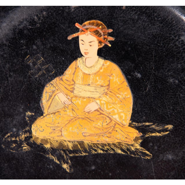 An antique 19th-Century English black lacquered papier mache wine coaster or tray with a handpainted Chinoiseirie figure...