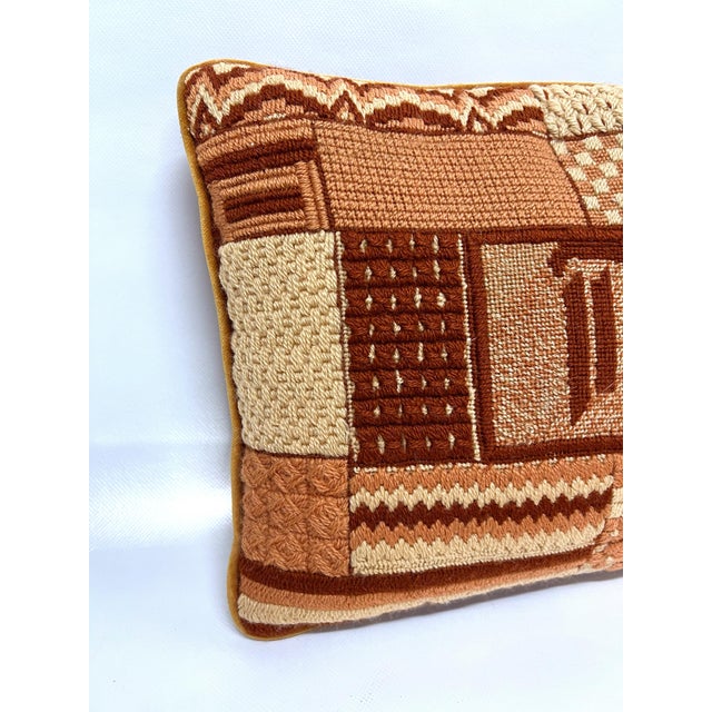 Excellent vintage “patchwork” needlepoint pillow. So many different patterns on this sweet pink pillow. Chevron, flowers,...