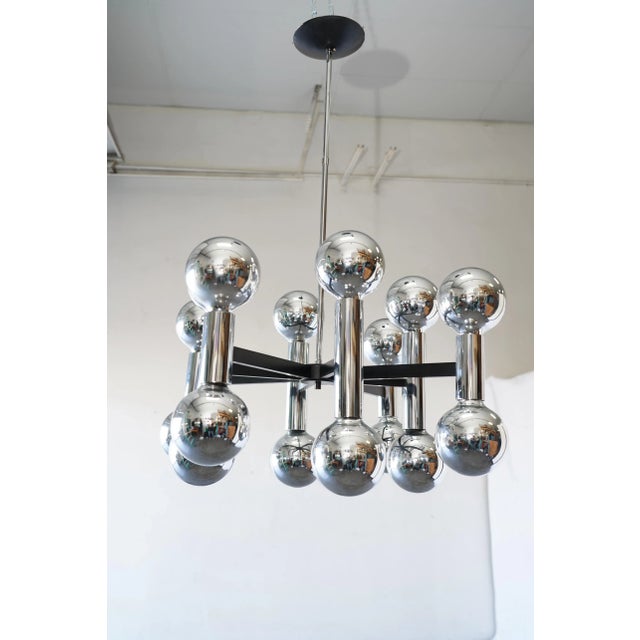 Striking mid-century modern chandelier featuring a bold Sputnik-inspired design with sixteen chrome ball light fixtures....