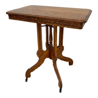 Antique Victorian Carved Quarter Sawn Oak Parlor Table on Casters, Eastlake Style For Sale