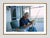 Howard Cushing by Toni Frissell Howard Cushing attaches fishing lure to his rod whilst relaxing on a porch in Newport,...