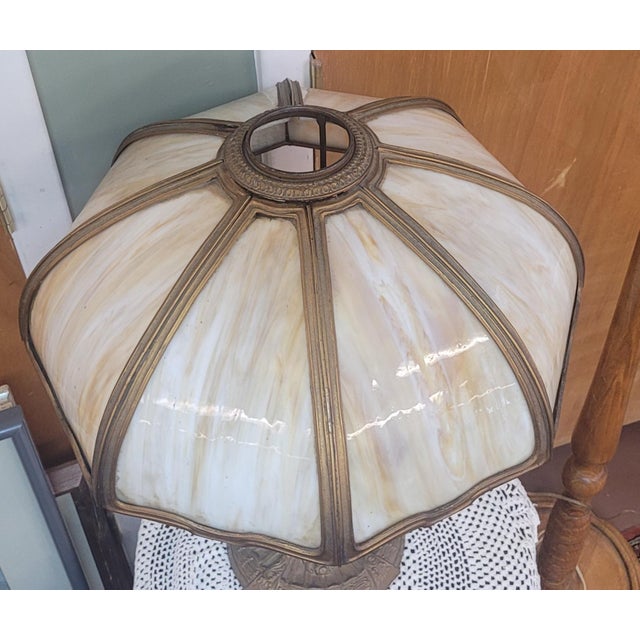 Nice antique slag glass gilt metal table lamp with fine detail. Features curved slag glass panels gilt white metal base...