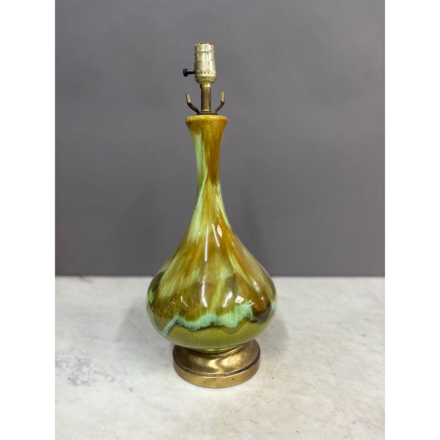 This is a gorgeous green glaze color with hints of brown and amber tones. From Royal Haeger Pottery Company of the 1950s &...