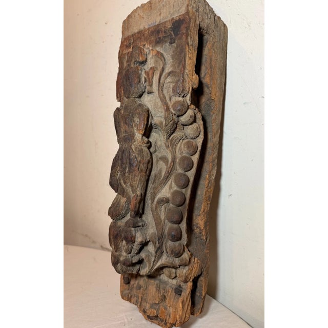 This large antique 17th century hand carved wooden Diety sculpture is a unique and one-of-a-kind piece of architectural...