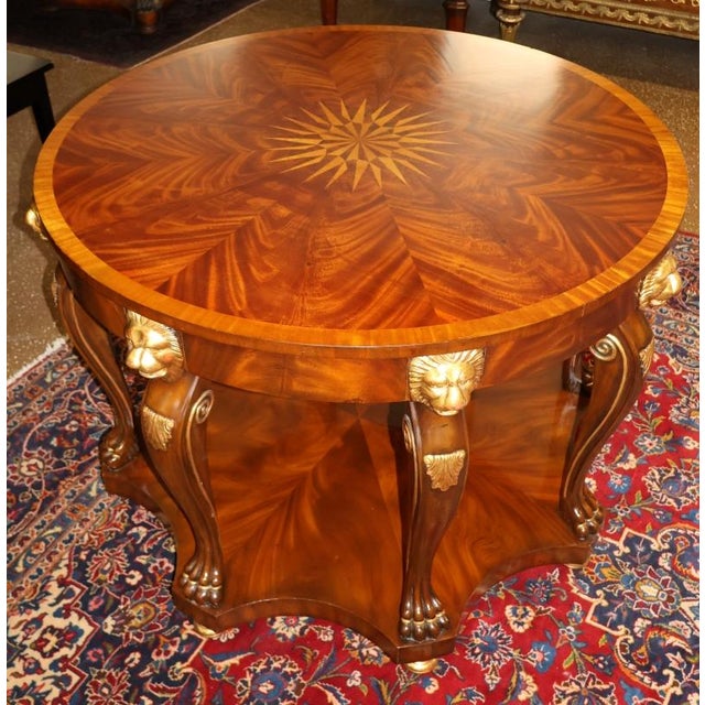 Maitland Smith Mahogany Inlaid Lion Carved Center Table Dimensions : 42" Diameter X 30.5" Tall This stunning table was...
