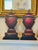 These are a striking pair of hand-painted wooden decorative urns, crafted as dimensional trompe l’oeil sculptures that...