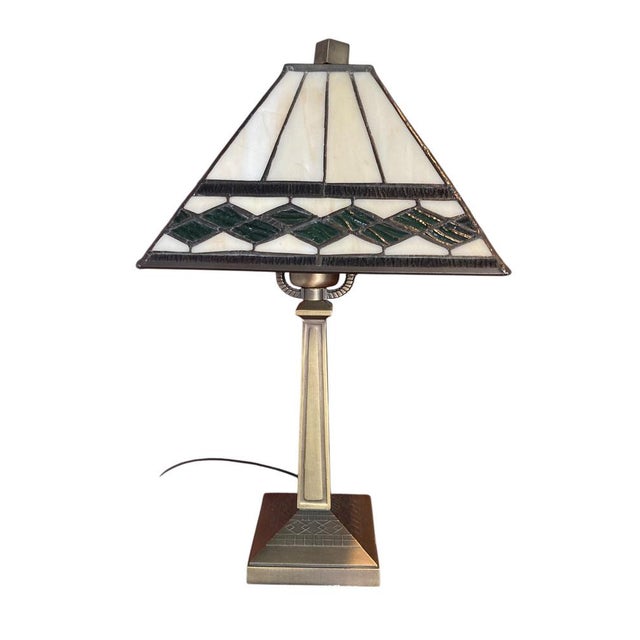 Art Deco Tiffanystyle table lamp&nbsp;characterized by its geometric, four-sided pyramid-shaped shade. The shade is...
