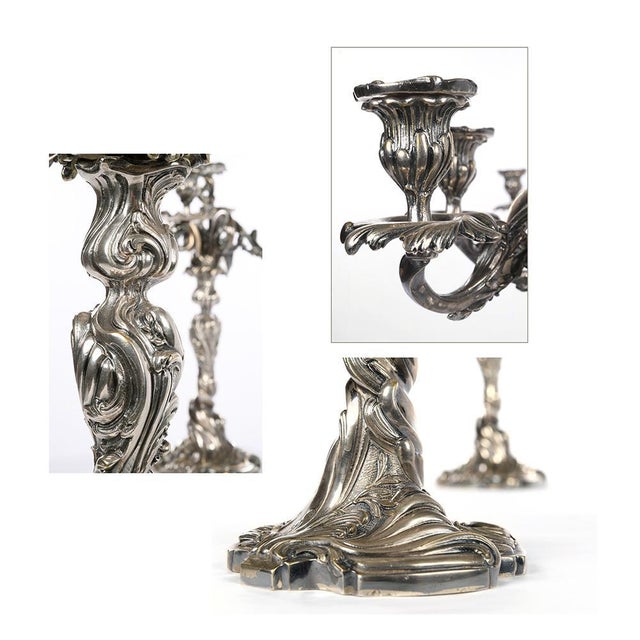 Pair of silver bronze candelabra. Decorative objects in silver-plated bronze. Each candlestick has 5 candleholders and a...