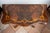 English card table in walnut and maple burl from the first half of the 19th century. The curved tabletop features an all-...