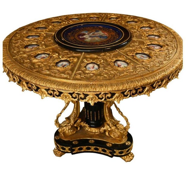 Superb quality circular centre table in the opulent french napoleon iii taste lavishly mounted in ormolu with intricate...