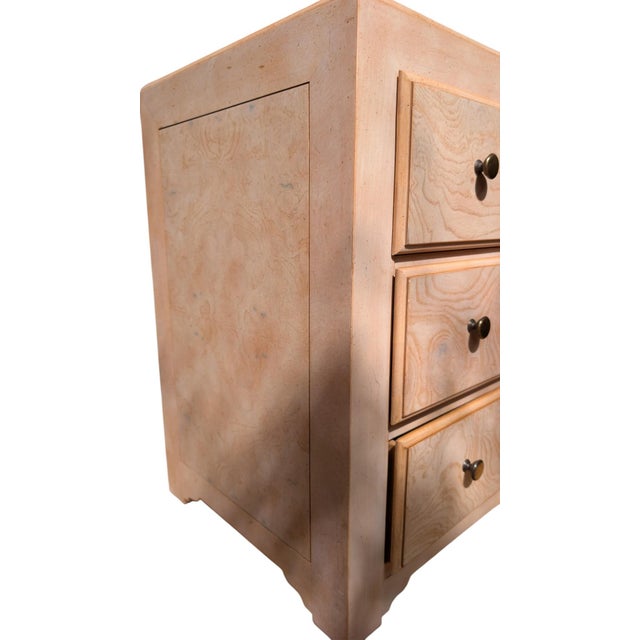 Vintage three-drawer bedside chest by Hekman, featuring striking bookmatched figured wood veneer across the drawer fronts...