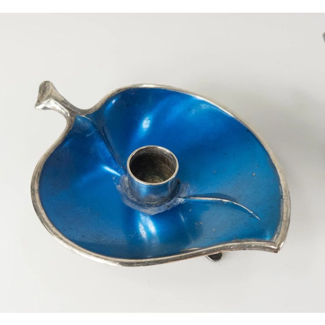 We are selling this pair of Mid-Century Danish modern style candle holders on leaf shaped dish with bright blue enamel....