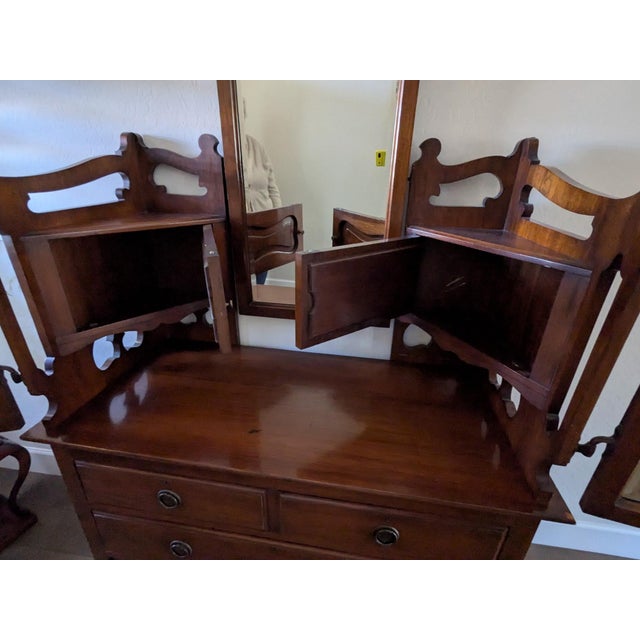 Striking late-19th-century Victorian dressing chest crafted from solid cherry and retaining its original mirrors,...