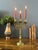 Vintage Brass 3 Arms Shabbat Candelabra Candle Holder, adorned with a pair of lions of Judaic Israel in an intricately...