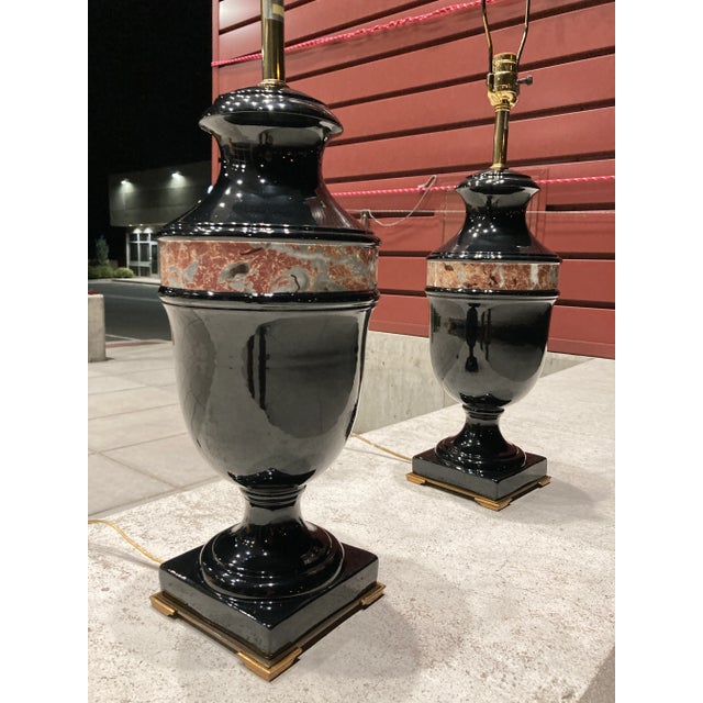Midcentury black glazed porcelain and bronze neoclassical table lamps by The Marbro Lamp Company, signed. Piece...