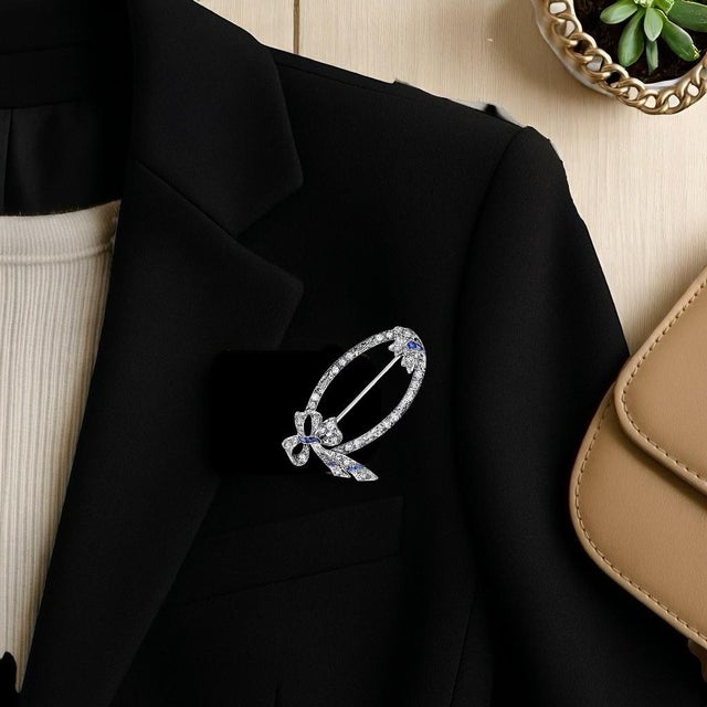 Introducing our exquisite Art Deco Sapphire, nine caliber cut sapphires weighing approximately 0.45 carats, and Diamond,...