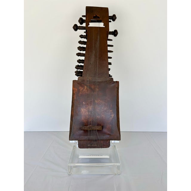 Eclectic decorative, conversation piece. This lovely wooden instrument is a Sarangi, it almost looks like an ancient...