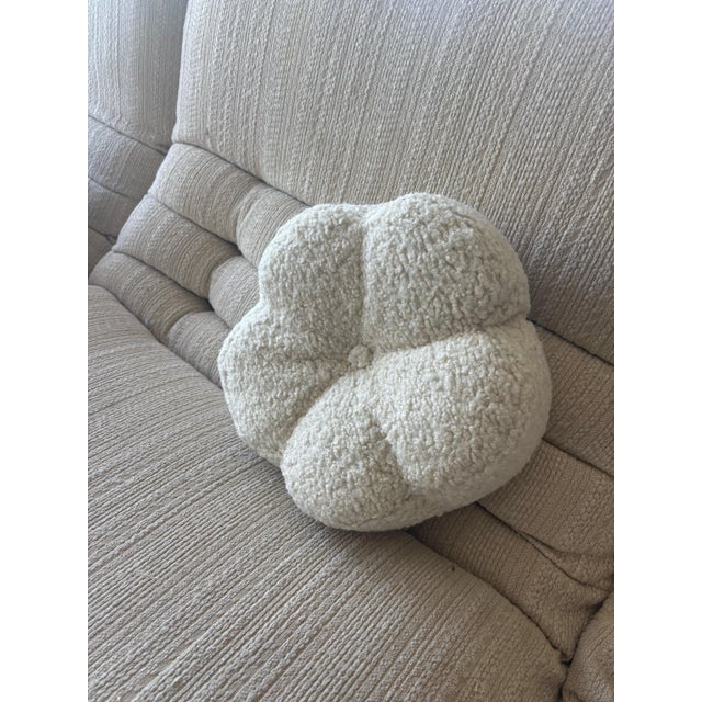 This custom double-sided cream bouclé flower-shaped pillow is a charming and cozy accent piece, perfect for adding texture...