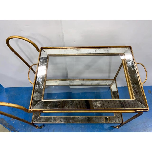 This stylish Century Furniture French modern gold leaf finished bar cart is so eye catching with its elegant curved...