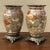 Pair 19th Century Oriental Satsuma Vases were hand-painted on the finest Japanese porcelain then set on cast bronze bases...
