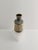 A gold and grey ceramic bottle vase, crafted by fratelli fanciullacci for elbee in italy during the 1950s. Formed in a...