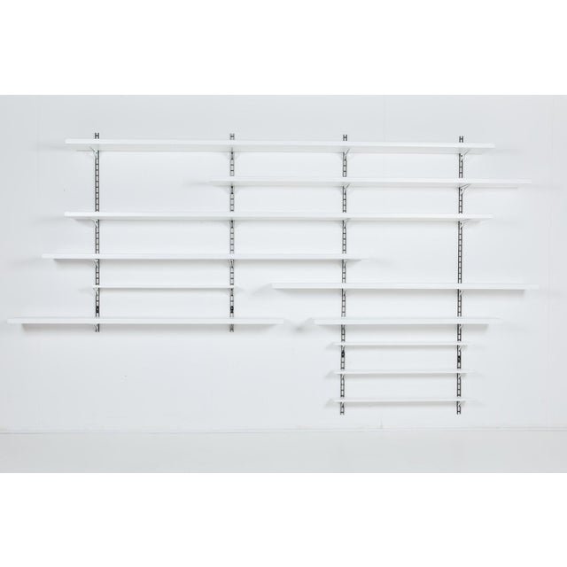 Modular shelving system manufactured in 1960’s, Italy. Equipped with adjustable shelves which can be organized/placed in...