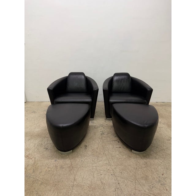 Pair of Art Deco Revival soft black leather lounge chairs with footrests by Enzo Luca, Netherlands 1990s. Measurements:...