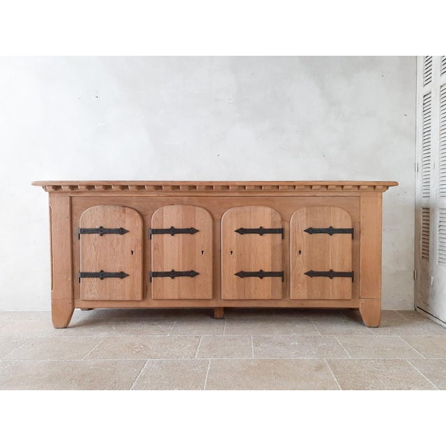 Mid 20th Century Spanish Oak credenza from the 1940s. Stunning solid oak sideboard with typical arched doors and large...