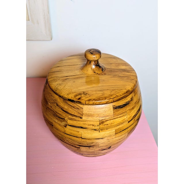 This is a lovely segmented parquetry lidded jar/canister. This studio art piece is estimated to be from the mid 20th...