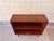 This Danish bookcase is crafted in warm teak and features a clean and functional design with balanced proportions and...